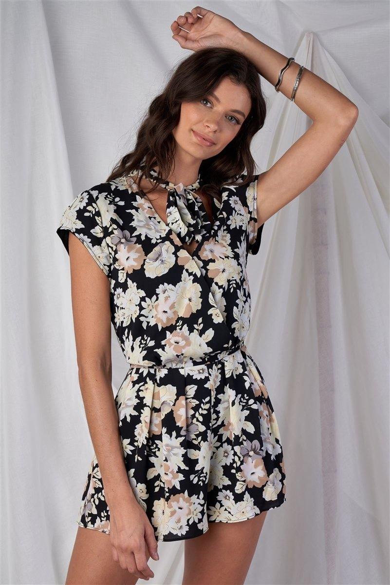 Black Multi Color Floral Print V-Neck Mini Sleeve Tight Fitted Waist Pleated Bottom Romper With Bow Tie Detail - Simpleaholic