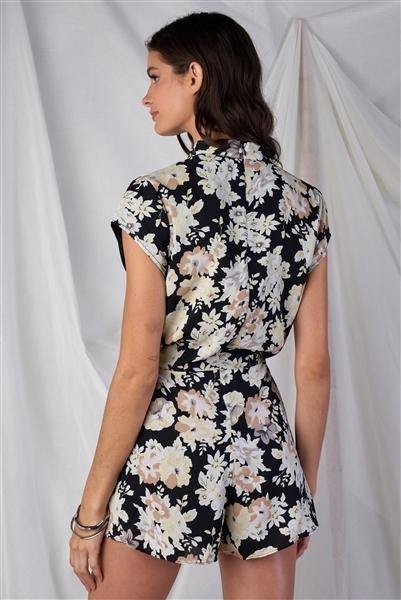 Black Multi Color Floral Print V-Neck Mini Sleeve Tight Fitted Waist Pleated Bottom Romper With Bow Tie Detail - Simpleaholic